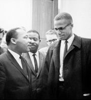 180px-MLK_and_Malcolm_X_USNWR_cropped Malcom X towers impressively over Martin Luther King.