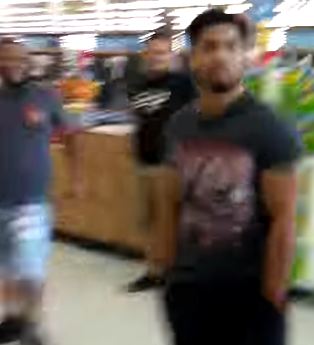 Rare footage shows two gangstalkers caught on film in a Linden, New Jersey Walmart. The man in the background is not involved.