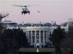 An emergency escape helicopter approaches the White House Friday morning as militias assemble at the gates